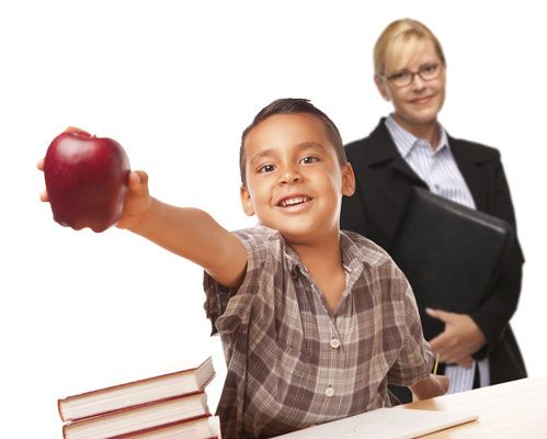 Educational Staffing student with apple and teacher